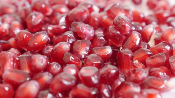 Red seeds of Lythraceae family pomegranate close-up  4K 3840X2160 UHD panning  video - Healthy Punic