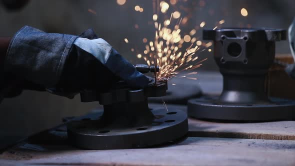 industrial safety first concept, Worker cutting metal with grinder