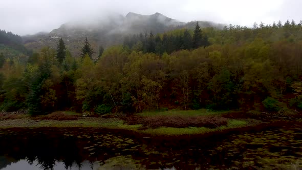 Aerial drone view of Loch Leven in Scotland on a moody misty day