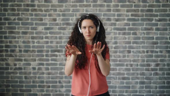 Portrait of Cheerful Dancer Listening To Music in Headphones Dancing Relaxing