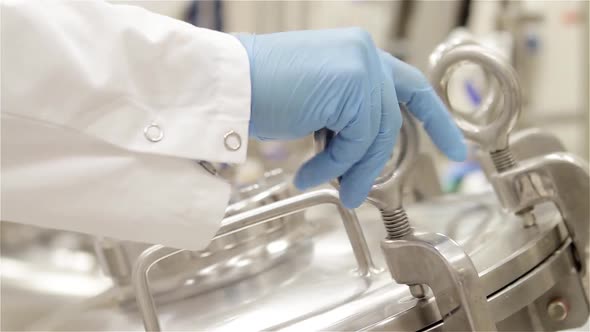 Pharmaceutical Worker working with a Tank in Lab.