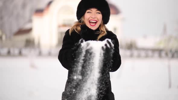 A Woman in a Winter Hat Smiles