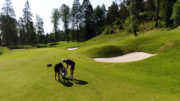 Golfer preparing to play on field of Hills golf club at Molndal near Gothenburg, Sweden. Aerial dron