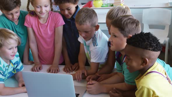Group of kids using laptop in the class