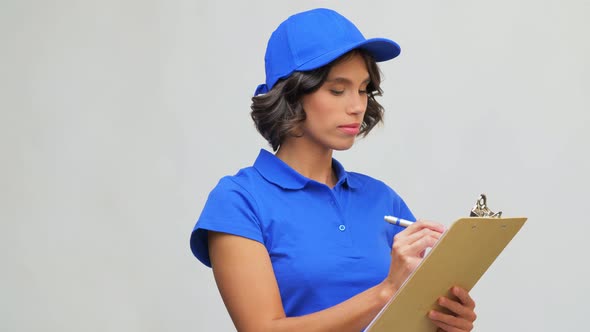 Delivery Girl with Clipboard and Pen Writing