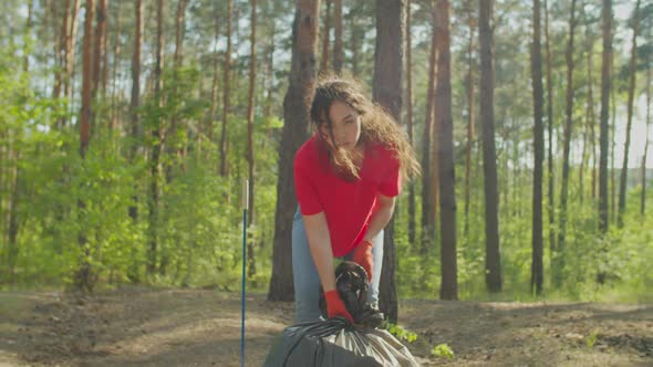 Asian Female Eco Activist Carrying Garbage Bag