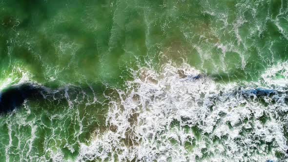 Waves on clear water in bay