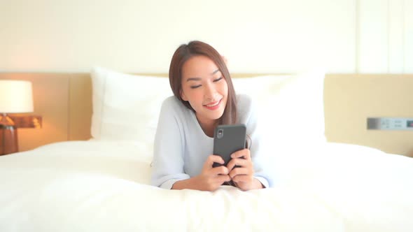 Young asian woman use smart phone