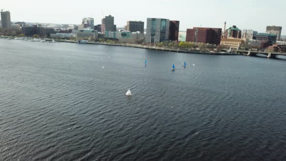 Aerial View Of Sailboats In Charles River With Boston Cityscape From Cambridge, Massachusetts - dron