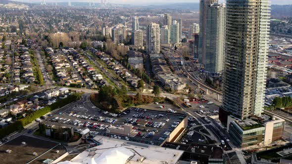 Flying Over Brentwood Town Centre, Shopping Mall In Burnaby, British Columbia, Canada. - aerial