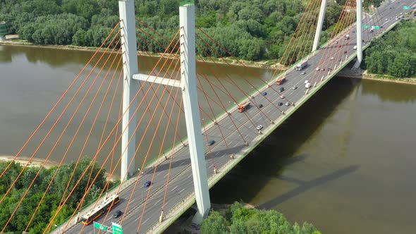 Modern cable stayed bridge and car traffic on background. Highway traffic jam. Aerial View