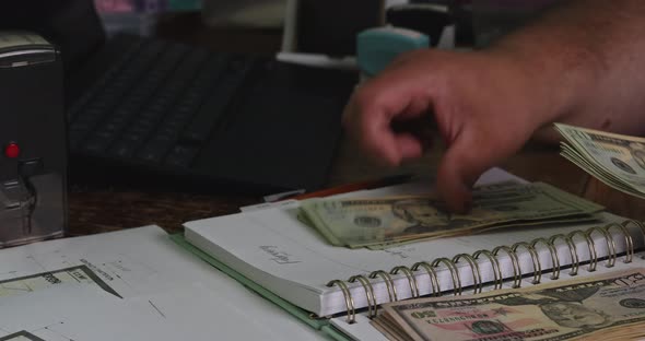 Hands of Man Accountant Counting Dollar Banknotes