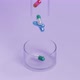 Capsule pills falling from test tube to Petri dish, healthcare medical concept - VideoHive Item for Sale
