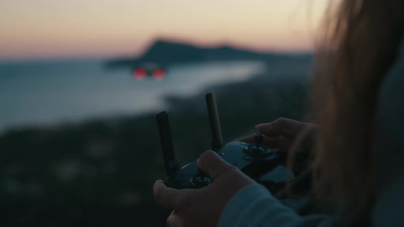 Close Up of Young Woman Hands Controlling Drone