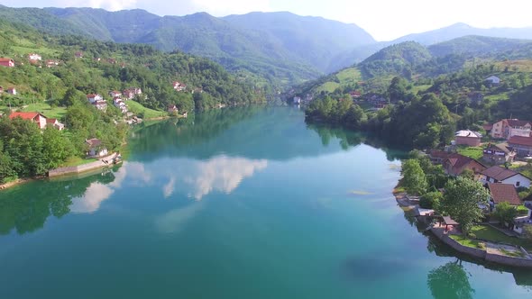 Flying over clear river in Bosnia