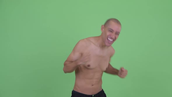 Happy Bald Multi Ethnic Shirtless Man Dancing