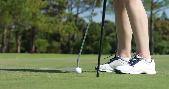 Golfer playing golf