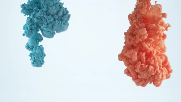 Slow motion shot of blue and orange ink into water, shot with Phantom Flex 4K camera. alt