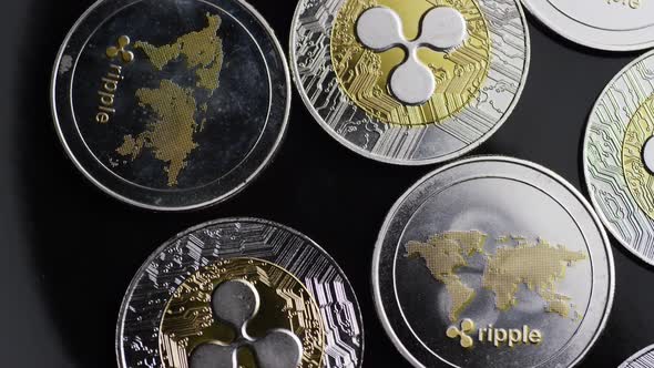 Rotating shot of Bitcoins (digital cryptocurrency) - BITCOIN RIPPLE