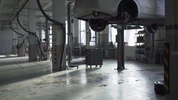 Service Station with Machines in Need of Repair alt