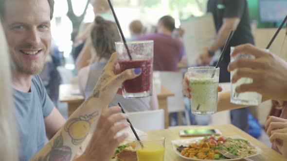 Friends celebrating together with meal at restaurant