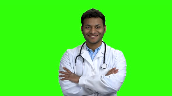 Happy Young Doctor Crossed Arms on Green Screen