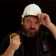 Concept idea: Funny bearded foreman with helmet takes a break and eats a healthy apple - VideoHive Item for Sale