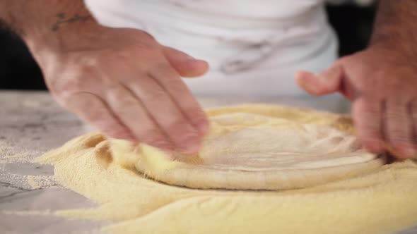 Italian Chef Making Dough for Pizza Traditional Food Man Working in Restaurant Kitchen High Cuisine