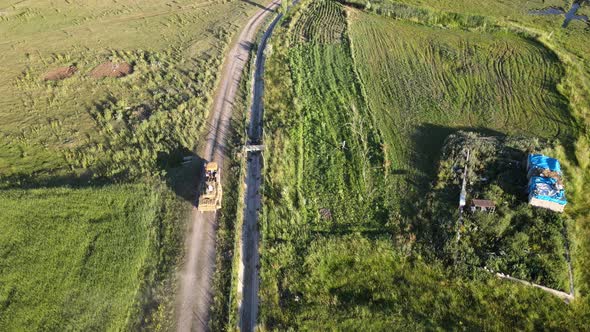 aerial drone view tractor on road