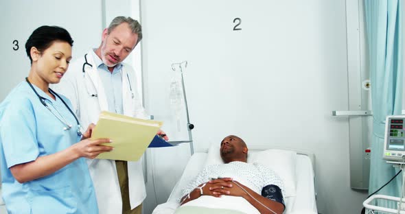 Doctor and nurse interacting with patient