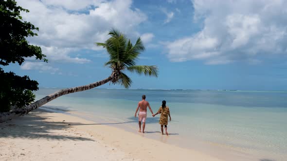 Anse Takamaka Beach Mahe Seychelles Tropical Beach with Palm Trees and a Blue Ocean Couple Man and