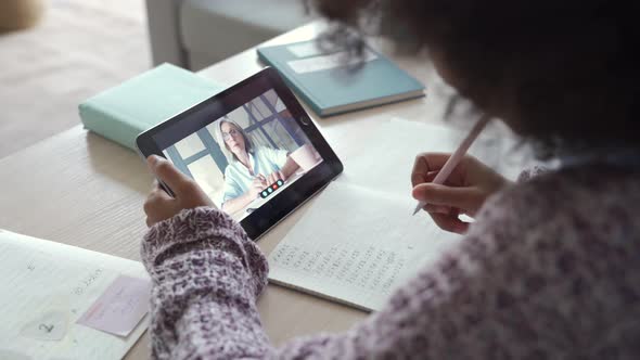 African Child Girl Holding Tablet Talking with Tutor on Distance Video Call