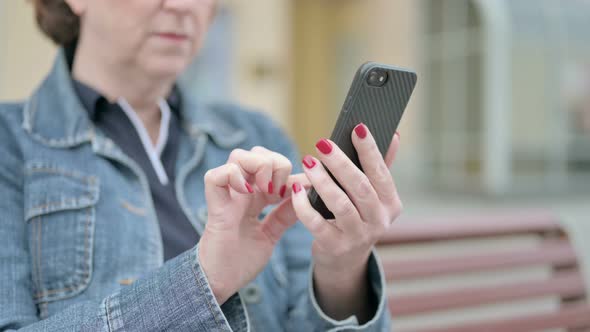 Close Up of Woman Using Smartphone Outdoor