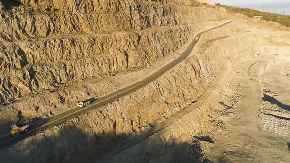 Top View Of Quarry With Trucks