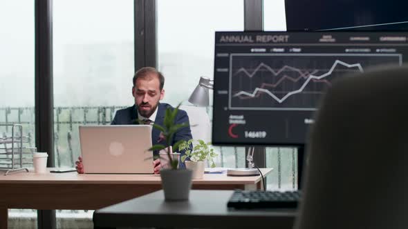 Businessman Alone in the Office Having a Video Conference