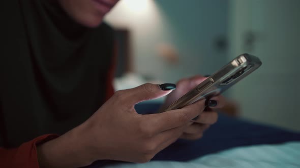 Arabian woman typing on phone