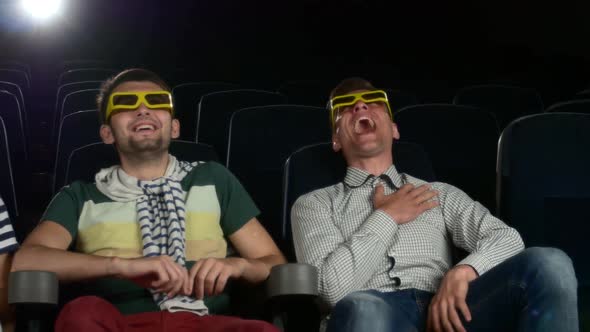 Young Friends Watching a Film at the Cinema