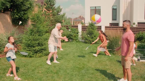 Big Active Family Playing Sports In Backyard