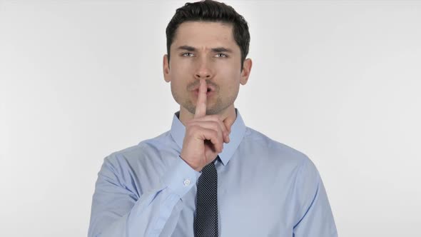 Finger on Lips Gesture of Silence By Businessman