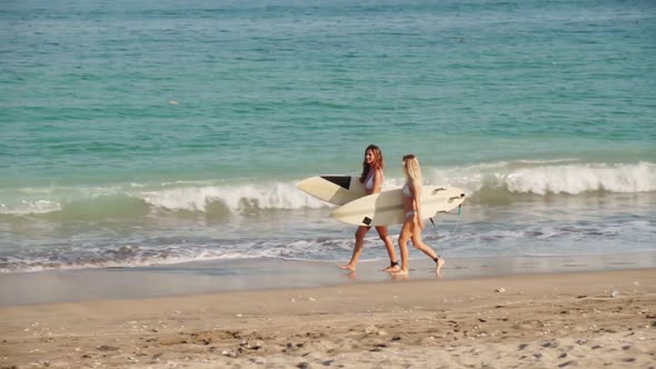 Sequence Of Women With Surfboards