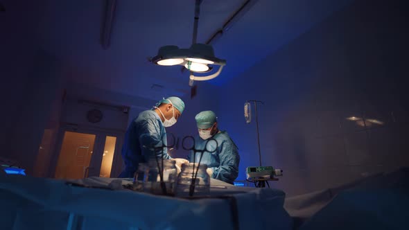 Surgeon with Nurse During an Operation in the Operating Room