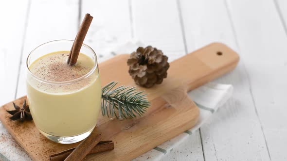 Homemade traditional Christmas eggnog drink in a glass