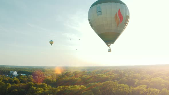Hot Air Balloon in the Blue Sky. Balloon Flies Against the Sunrise. Beautiful Romantic Summer Scene 