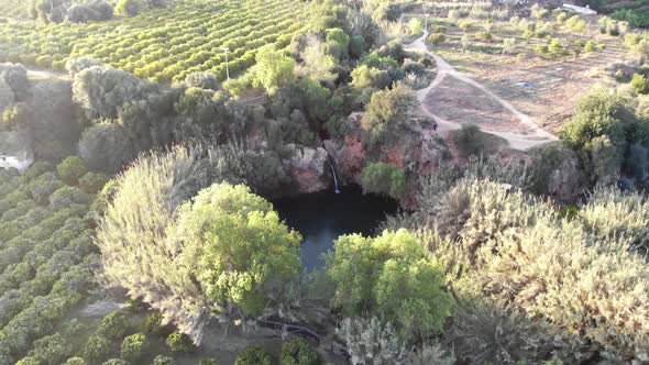 Aerial 4k footage of the landscape around the Pego Do Inferno waterfall in Portugal.