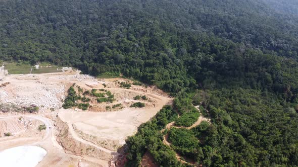 Aerial deforestation for land quarry