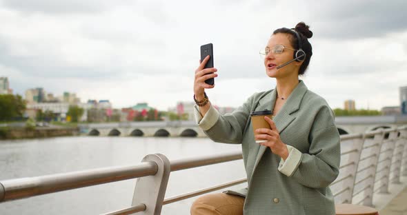 A Young Woman Blogger is Broadcasting Online She Talks About Current Events Online Using Her