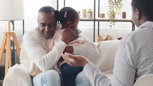 Mature Man African Father Holding Little Daughter Child Girl Talking to Unrecognizable Unknown Afro