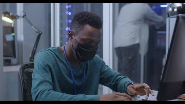 Young Man Working in Data Center