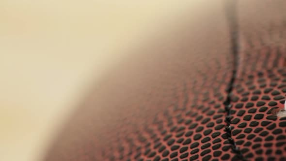 Close up of brown leather and white laces of American Football.