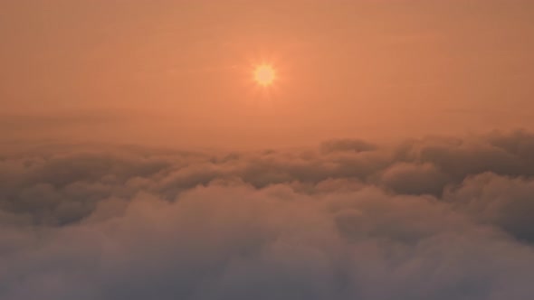 Fluffy Cumulus Clouds Float Under